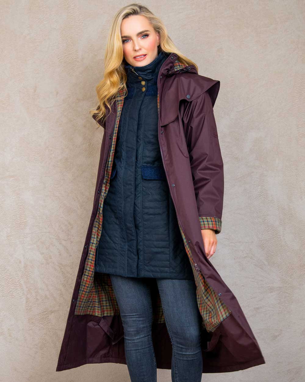 Deep Claret coloured Jack Murphy Malvern Ladies Waterproof Bush Coat on wall background