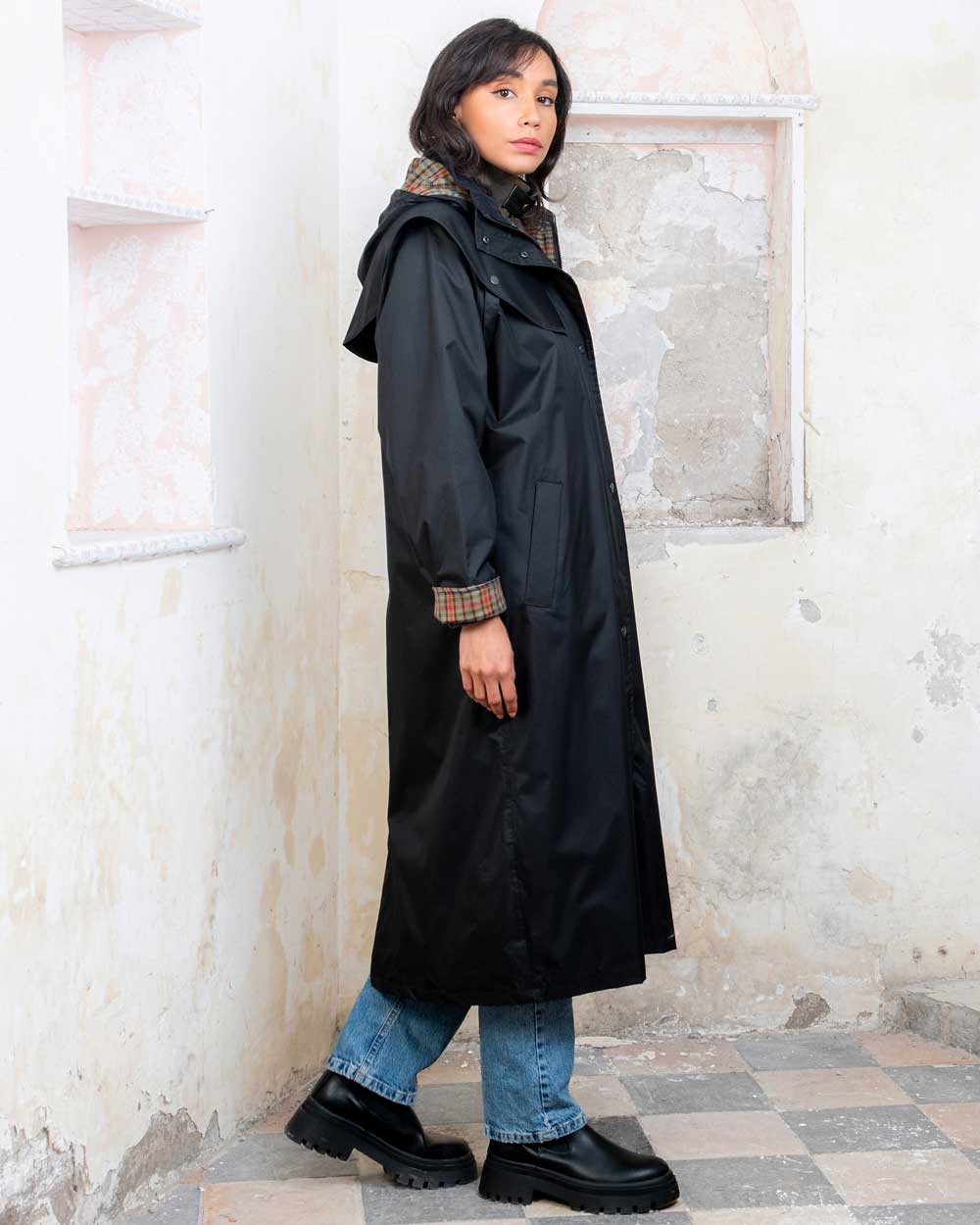 Black coloured Jack Murphy Malvern Ladies Waterproof Bush Coat on wall background