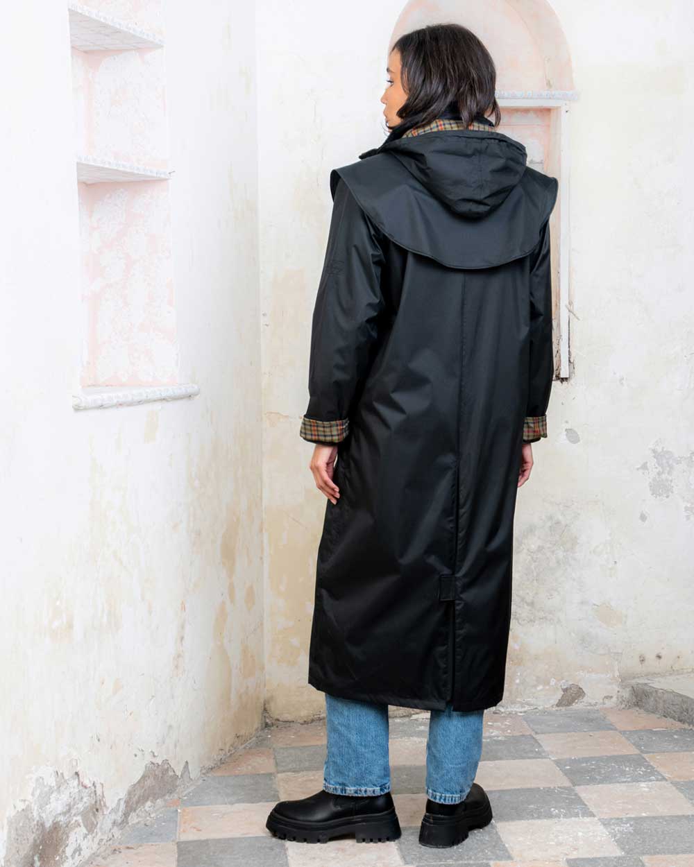 Black coloured Jack Murphy Malvern Ladies Waterproof Bush Coat on wall background
