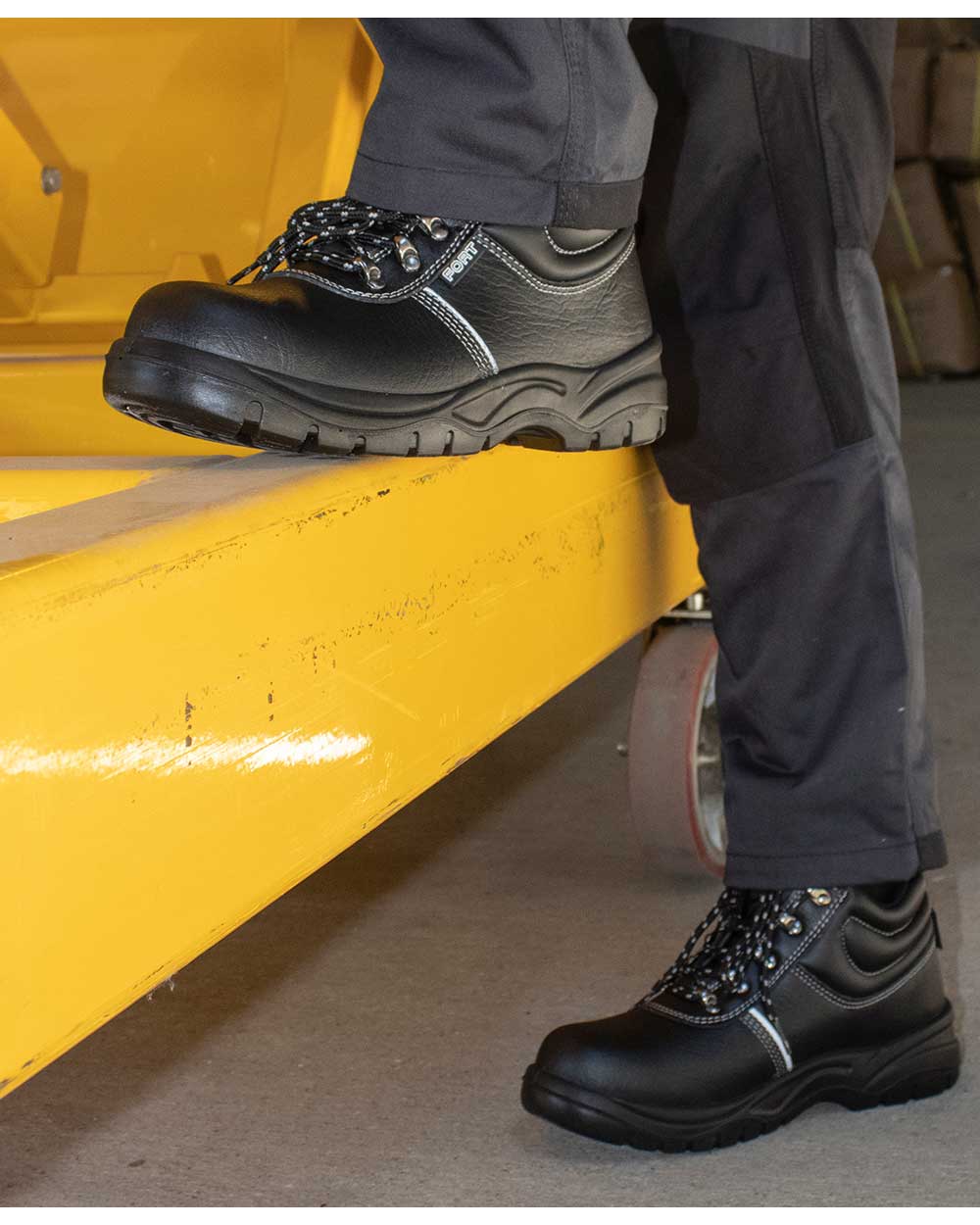 MAn working in Fort Workforce Safety Boots in Black