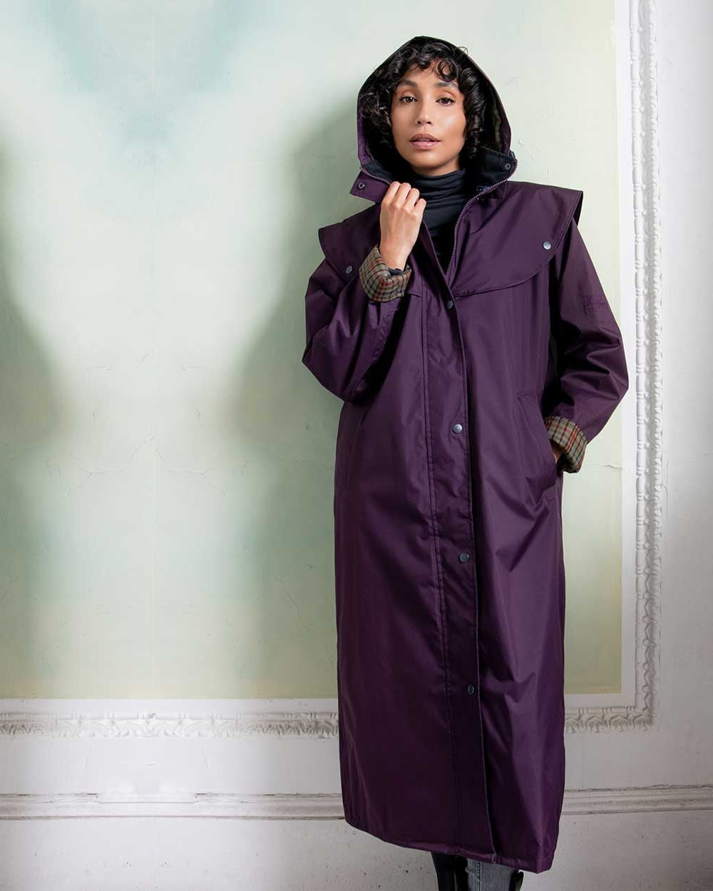 Blackberry coloured Jack Murphy Malvern Ladies Waterproof Bush Coat on wall background