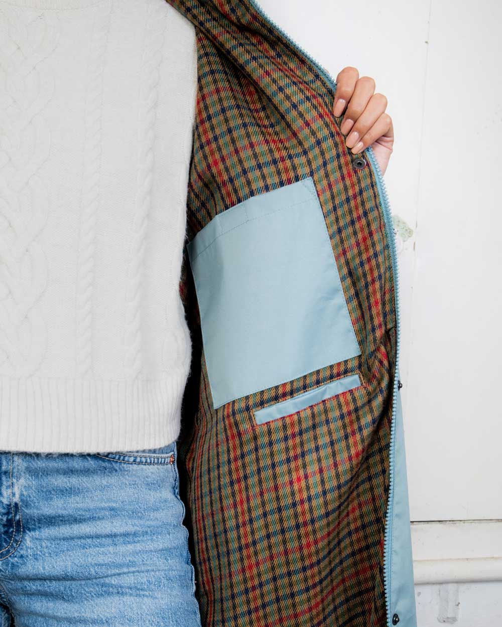 Smokey Blue coloured Jack Murphy Malvern Ladies Waterproof Bush Coat on wall background