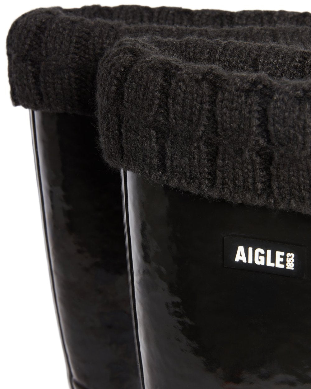 Noir coloured Aigle Womens Eliosa Fur Lined Wellingtons on white background