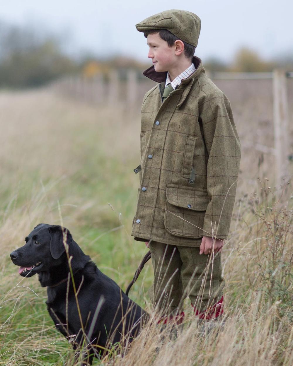 Lichen coloured Alan Paine Childrens Tweed Water Repellent Breeks on grassy background