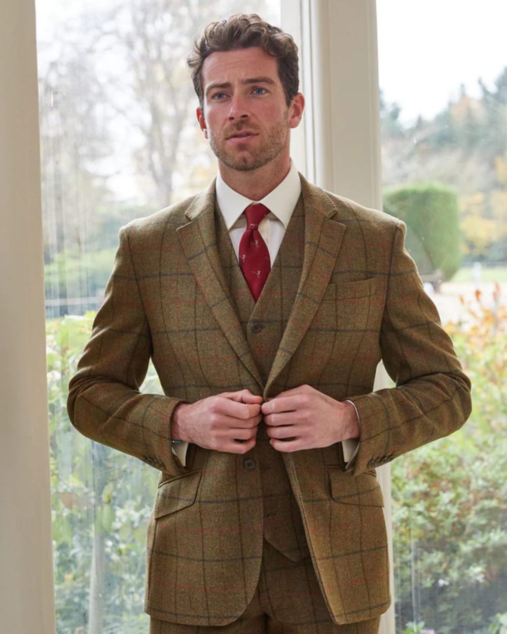 Thyme coloured Alan Paine Combrook Mens Tweed Sports Blazer on window background