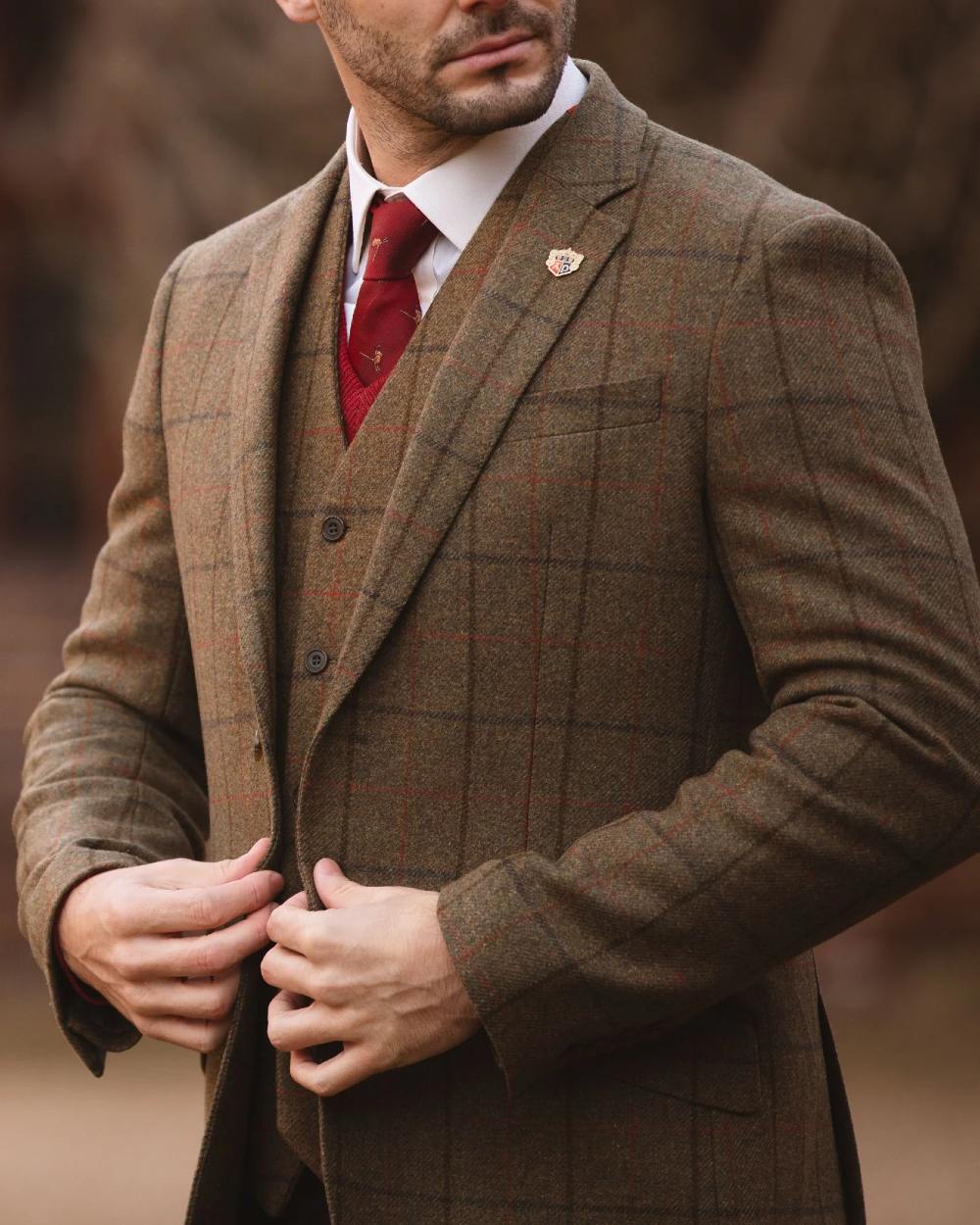 Thyme coloured Alan Paine Combrook Mens Tweed Sports Blazer on blurry background