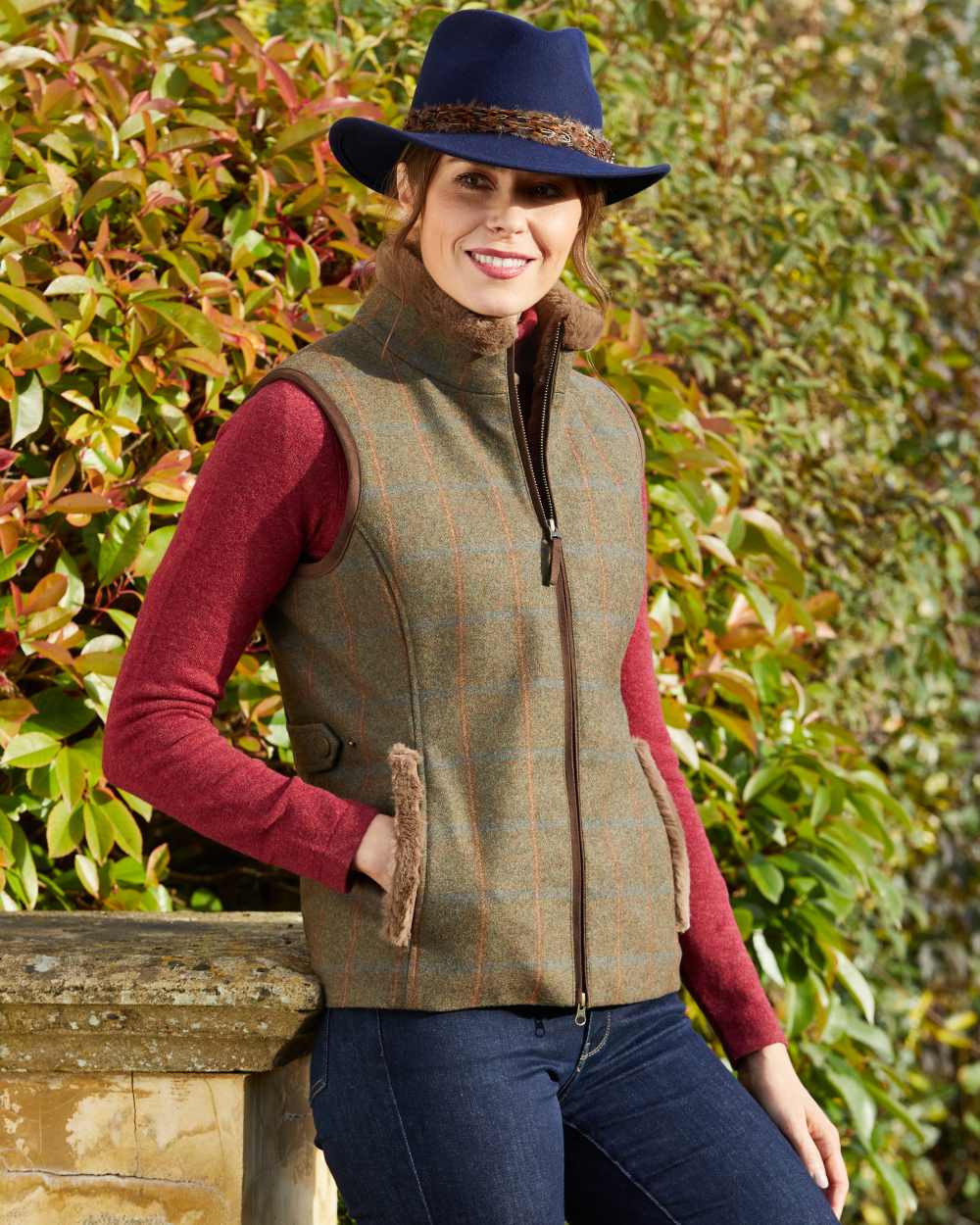 Willow Coloured Alan Paine Combrook Tweed Ladies Gilet on leafy background