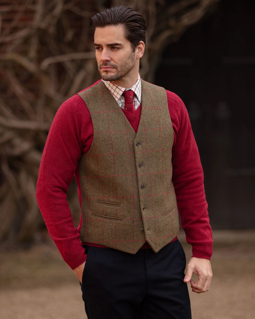 Sage coloured Alan Paine Mens Combrook Tweed Lined Back Waistcoat on blurry background