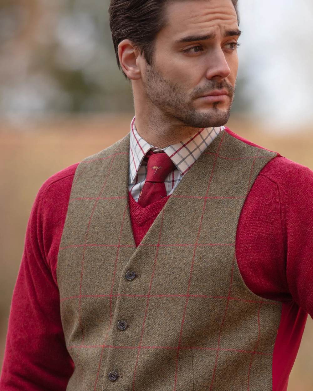 Sage coloured Alan Paine Mens Combrook Tweed Lined Back Waistcoat on blurry background