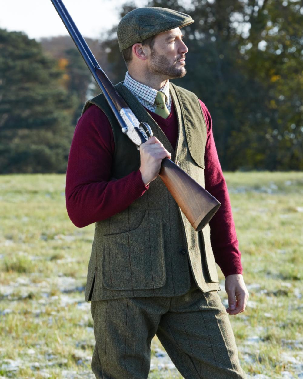 Oak coloured Alan Paine Rutland Tweed Shooting Waistcoat on forest background