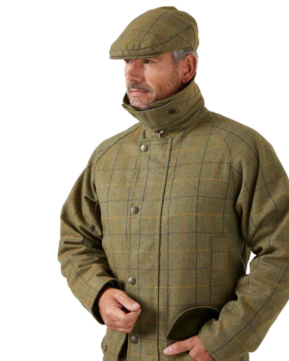 Dark Moss coloured Alan Paine Rutland Waterproof Tweed Shooting Coat on white background