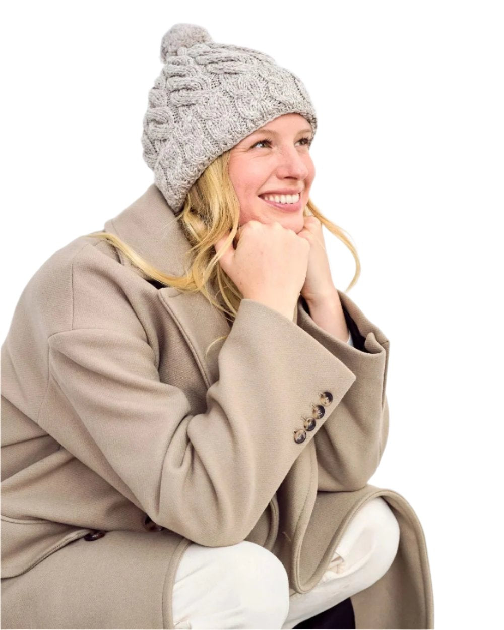 Beige Coloured Aran Chunky Knit Bobble Hat on white background