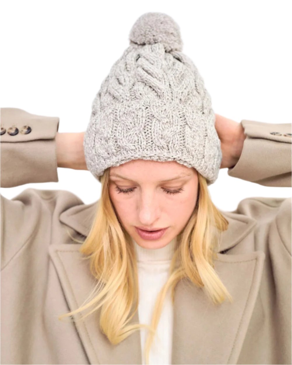 Beige Coloured Aran Chunky Knit Bobble Hat on white background