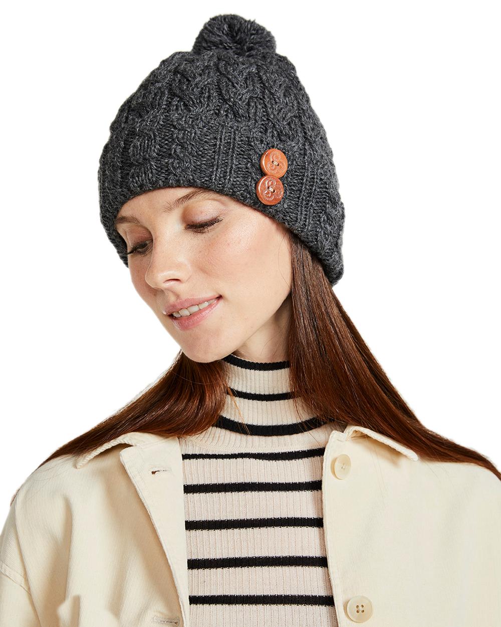 Grey Coloured Aran Chunky Knit Button Bobble Hat on white background