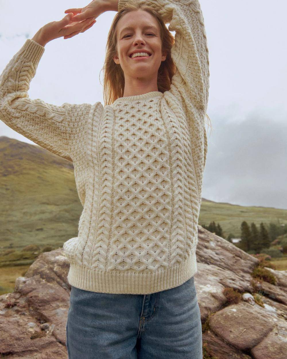 Cream Coloured Aran Inisheer Traditional Sweater on sky background