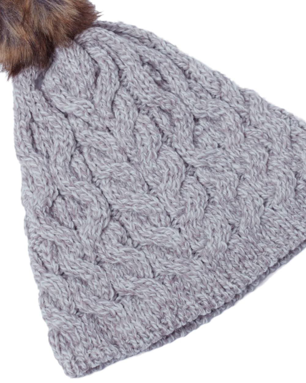 Beige Coloured Aran Knitted Faux Fur Bobble Hat on white background