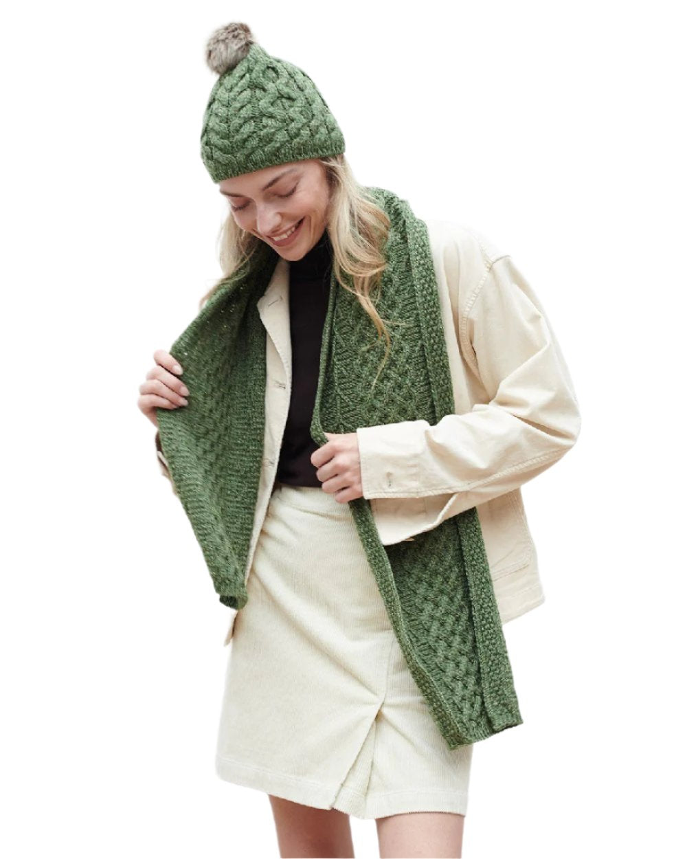 Sage Green Coloured Aran Knitted Faux Fur Bobble Hat on white background
