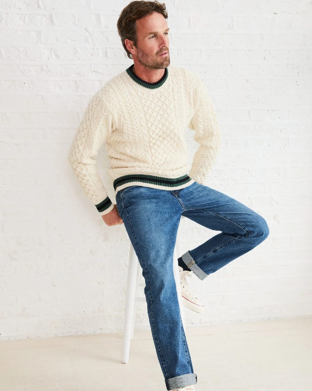 Cream Coloured Aran Mens Inishbeg Stripe Crewneck Merino Sweater on indoor background
