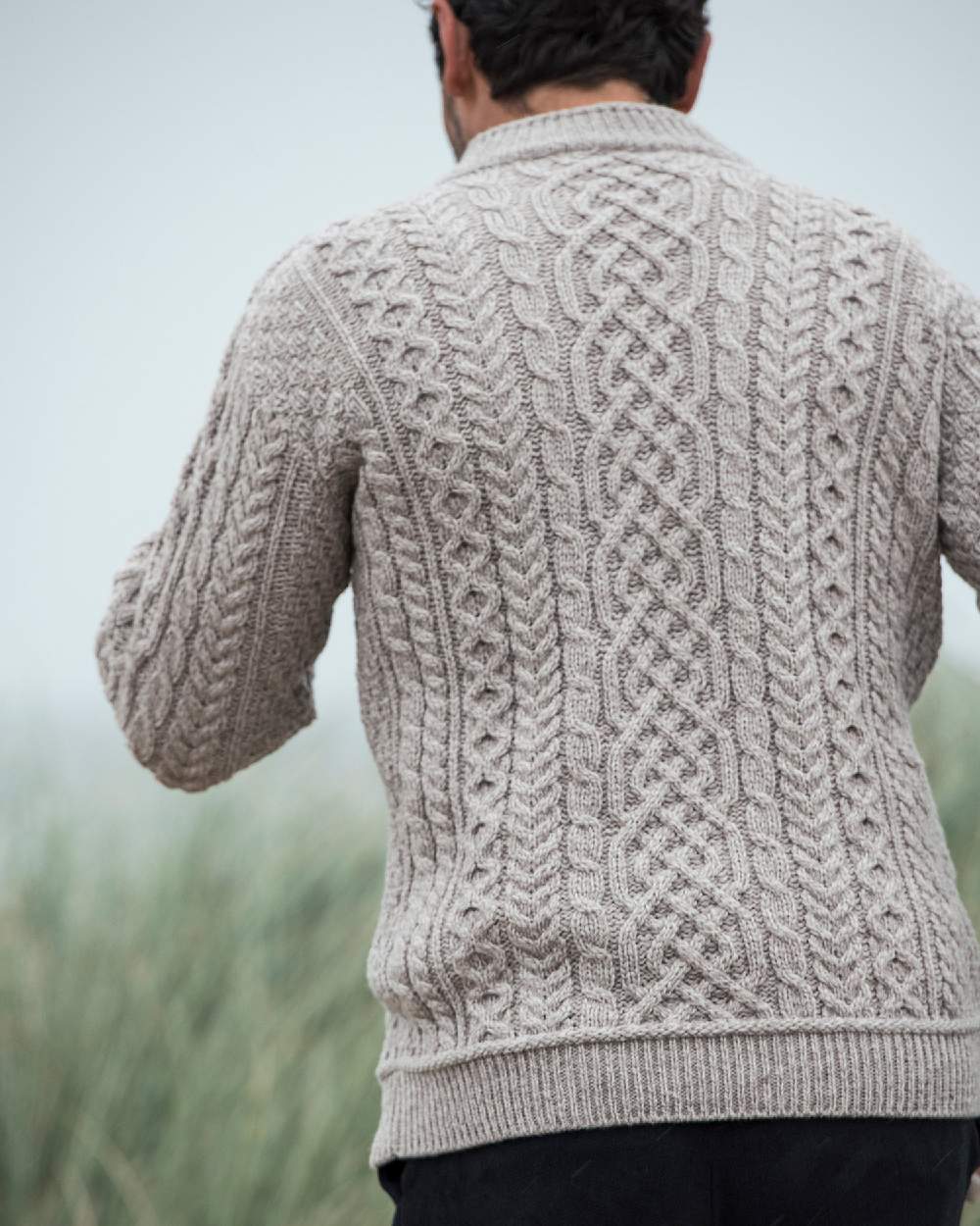 Oat Coloured Aran Supersoft Merino 1/2 Zip Jumper on blurry background