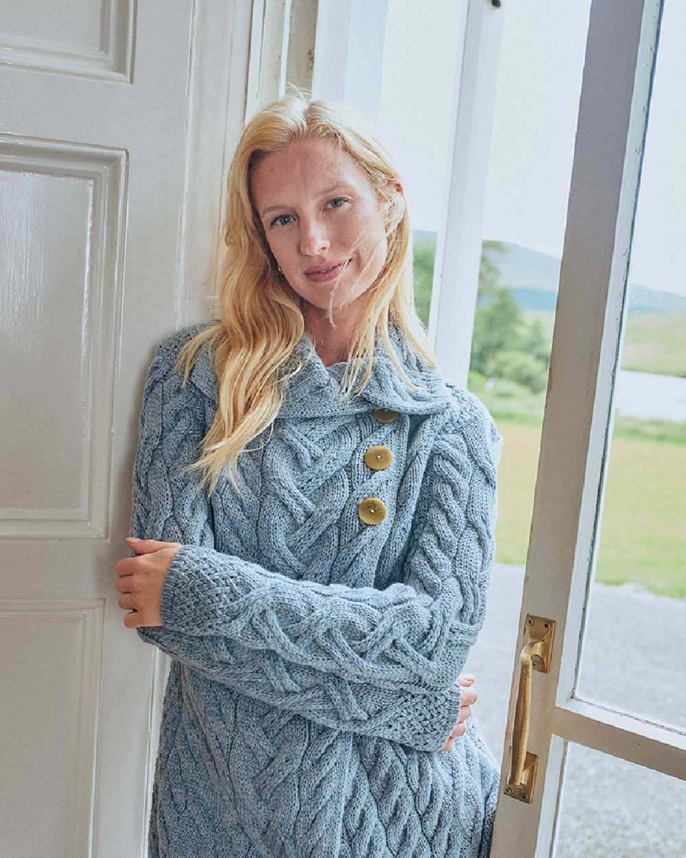 Ocean Grey Coloured Aran Supersoft Merino Wool Long Cardigan on door background