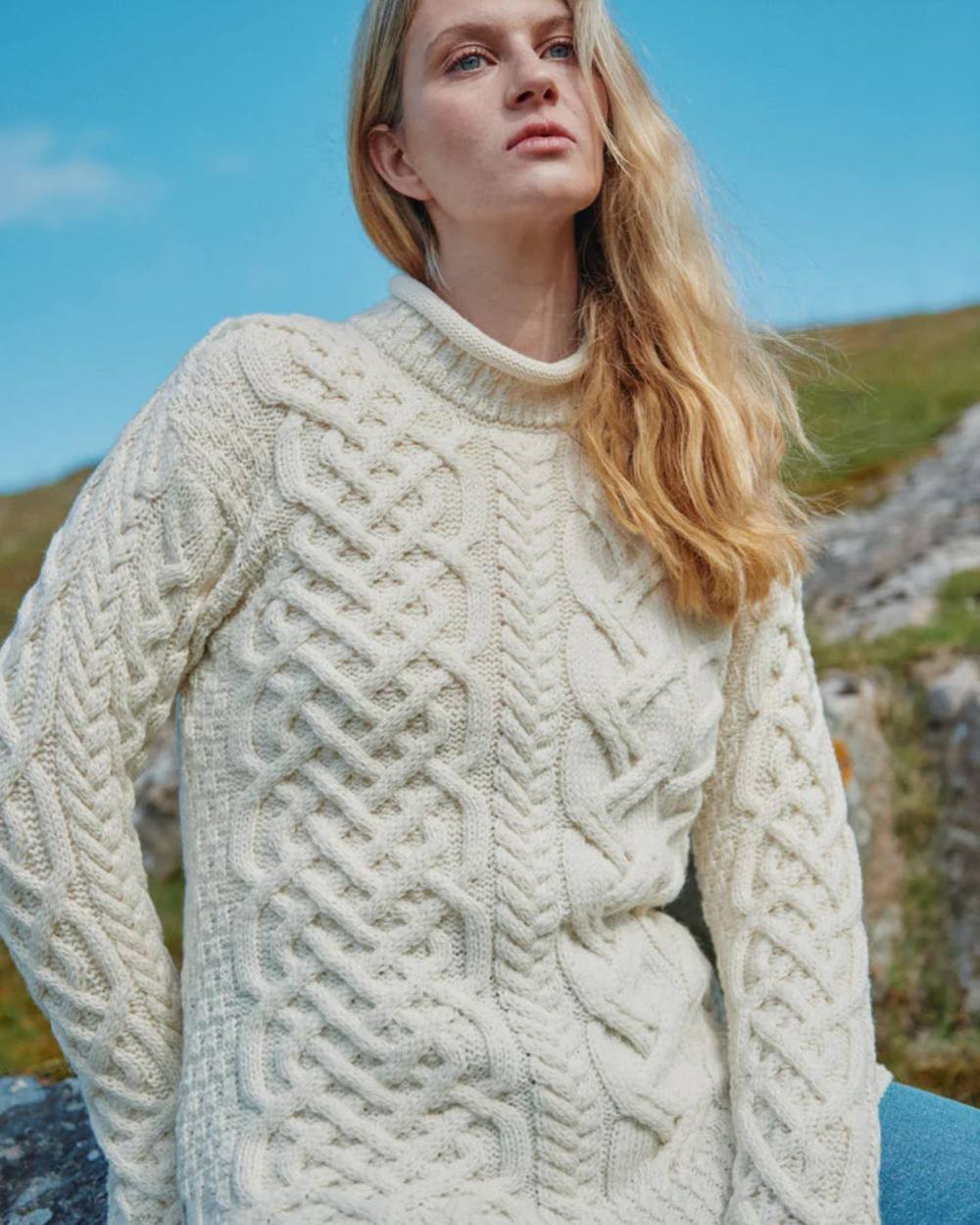 Cream Coloured Aran Womens Calla Aysmmetrical Pattern Sweater on outdoor background