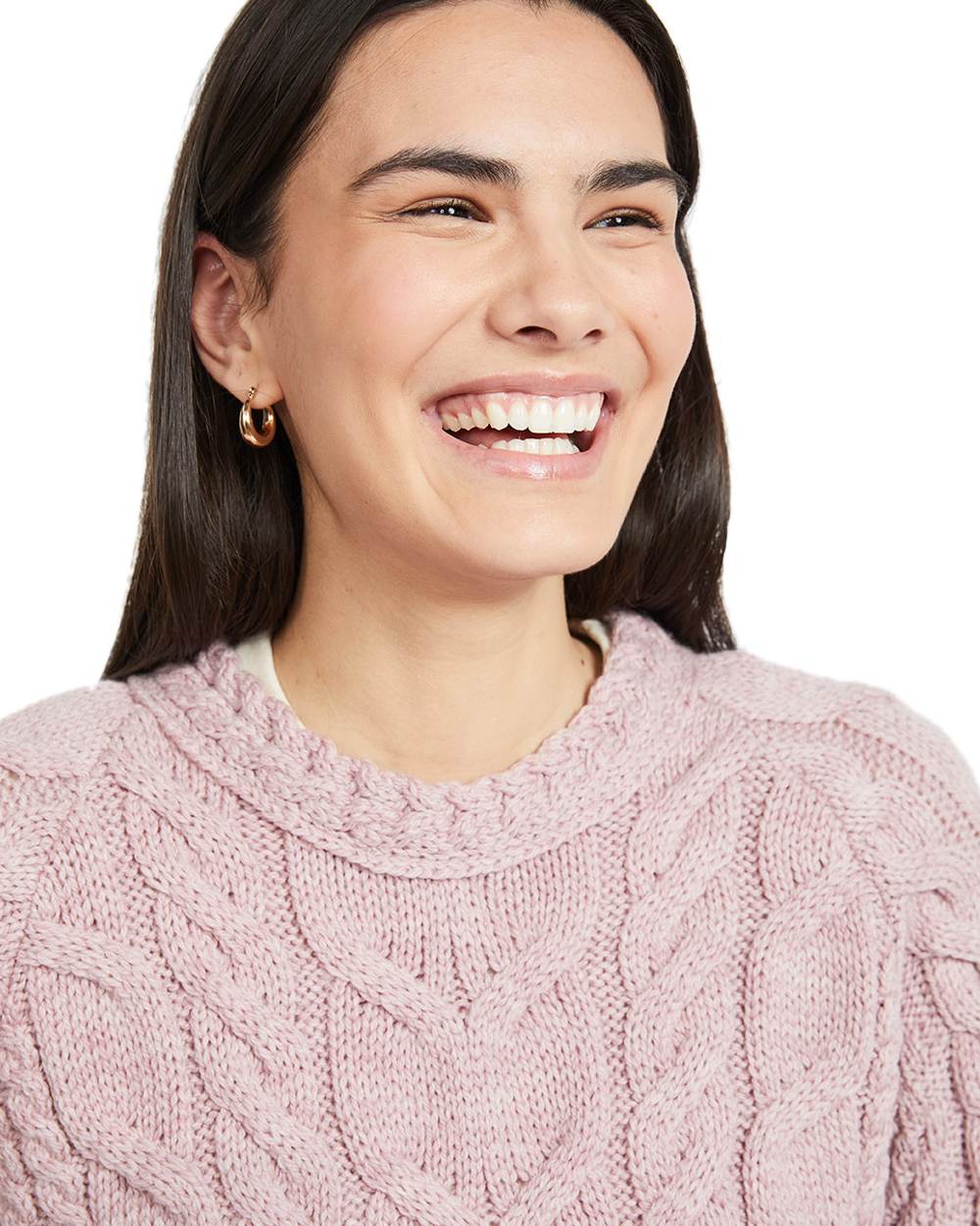 Pink Coloured Aran Womens Listowel Cabled Sweater on curtain background