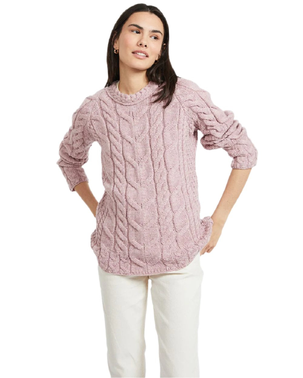 Pink Coloured Aran Womens Listowel Cabled Sweater on curtain background