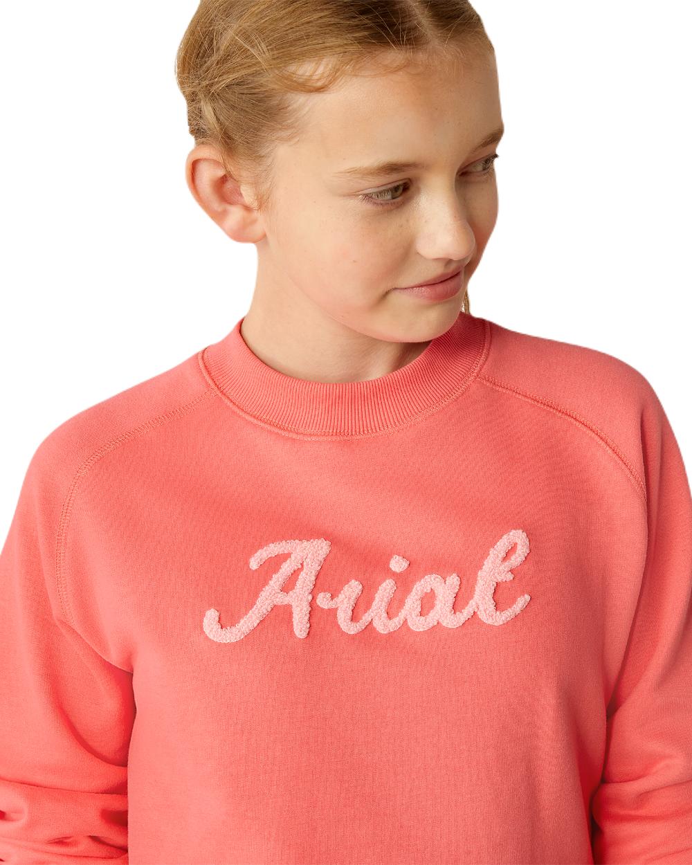 Coral Paradise coloured Ariat Childrens Benicia Sweatshirt on white background