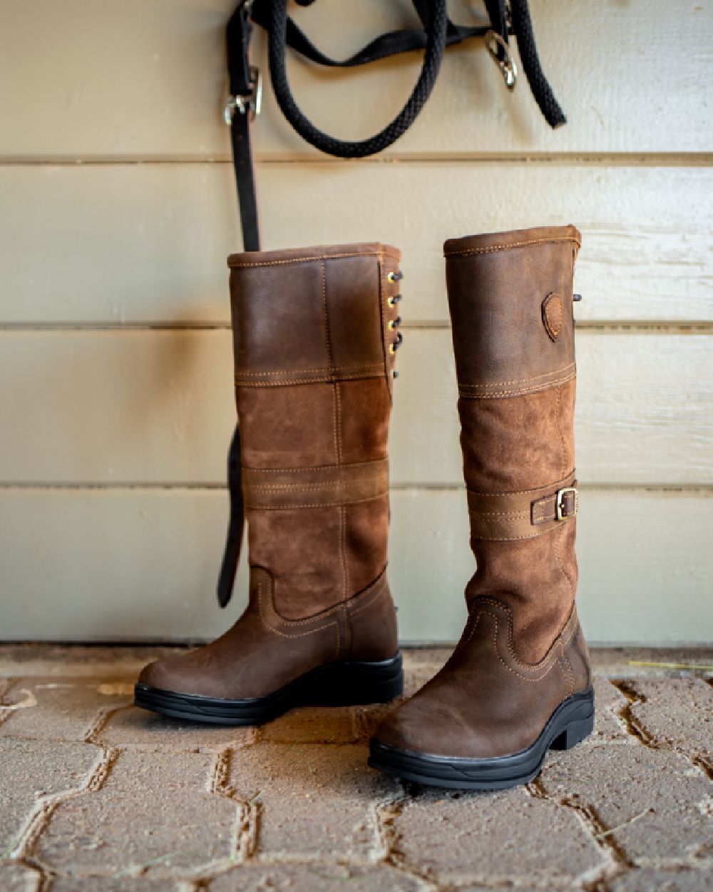Java coloured Ariat Langdale Waterproof Boots on stable background