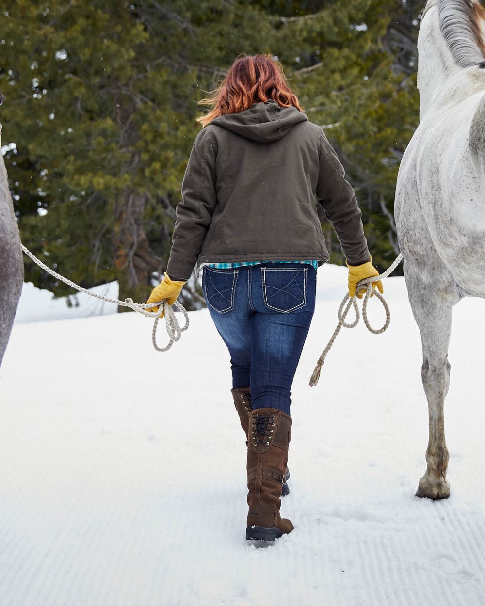 Java coloured Ariat Langdale Waterproof Boots on snow background
