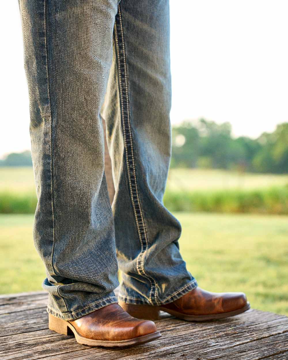 Barn Brown Coloured Ariat Mens Midtown Rambler Western Boots on countryside background