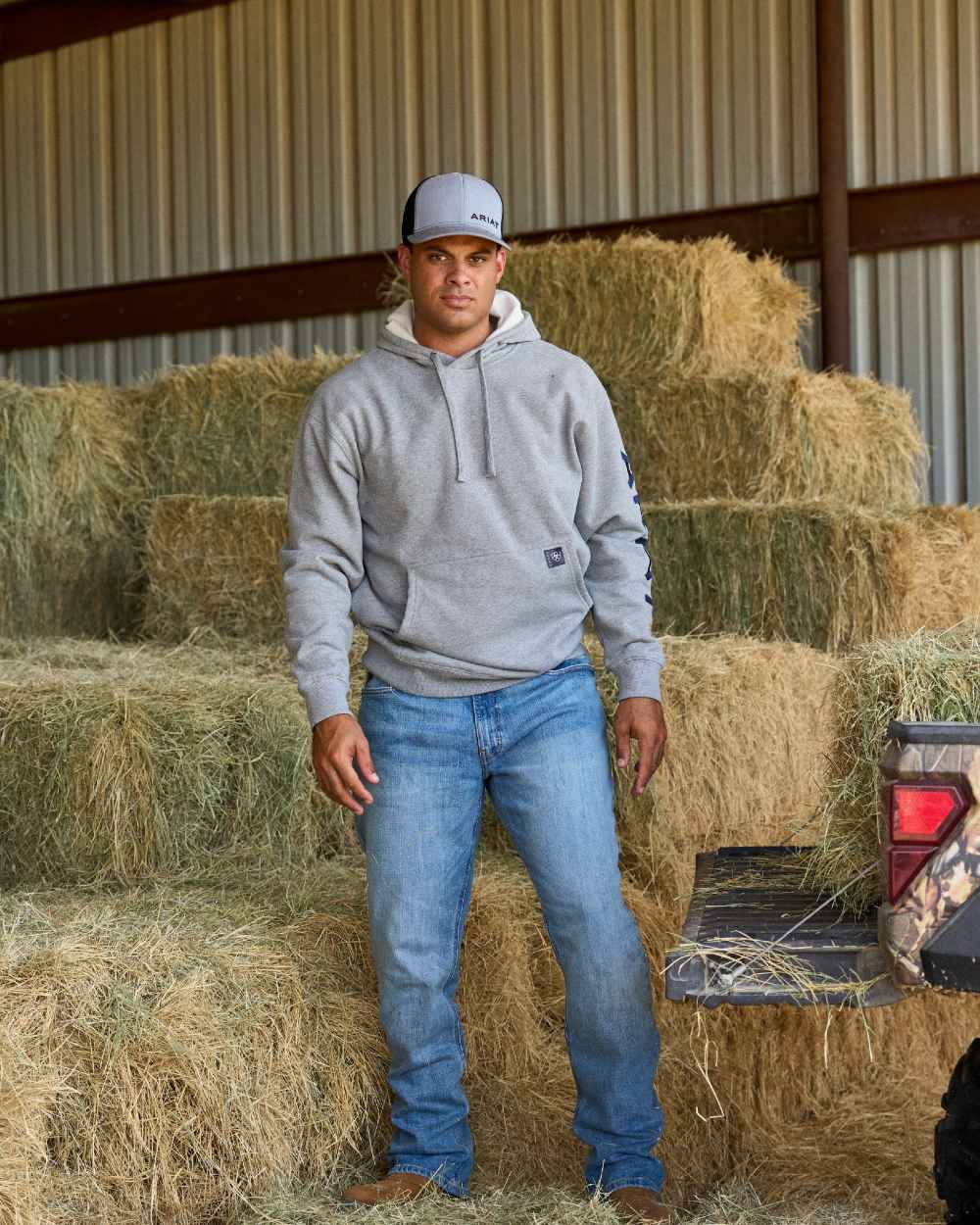 Heather Grey Deep Ultramarine Coloured Ariat Mens Rebar Graphic Hoodie on outdoor background