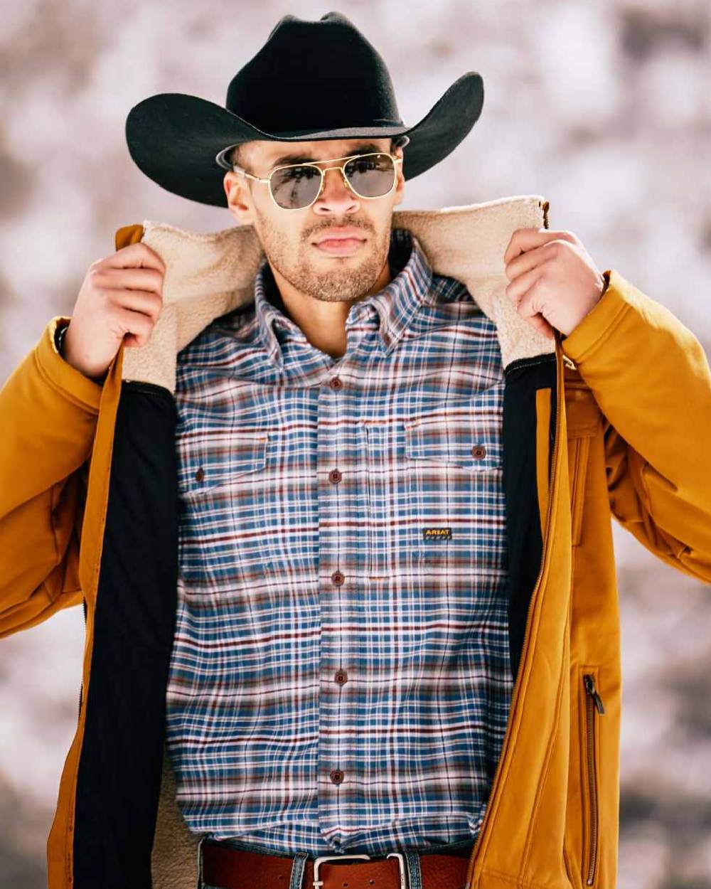 Alloy Grey coloured Ariat Rebar Flannel Durastretch Work Shirt on blurry background