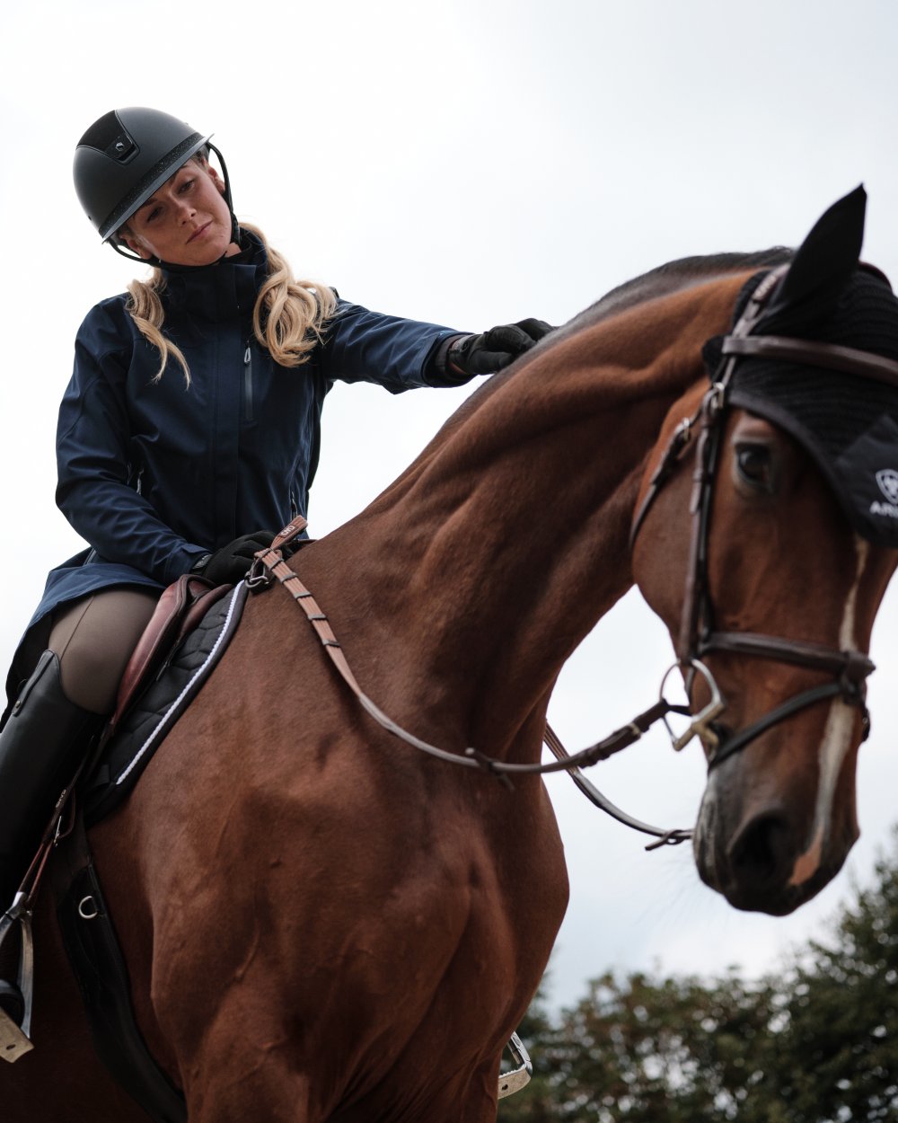 Navy Eclipse Coloured Ariat Womens Coastal Long Waterproof Parka on outdoor background
