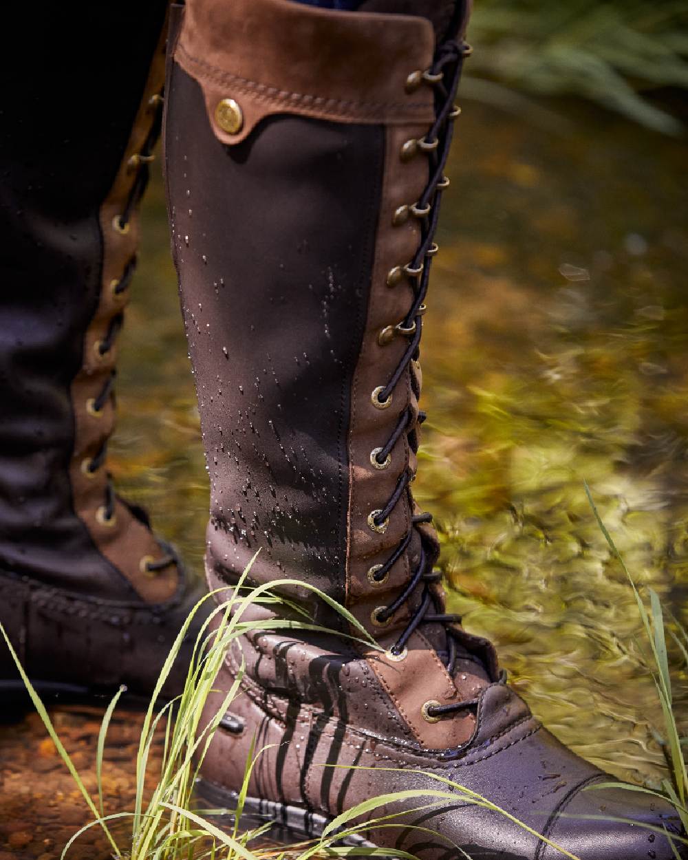 Ebony Brown Coloured Ariat Womens Coniston Max Waterproof Insulated Boot on pond background