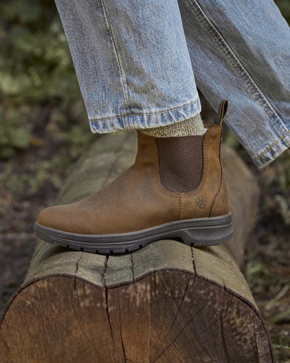 Distressed Copper coloured Ariat Womens Cooper Chelsea Boots on forest background