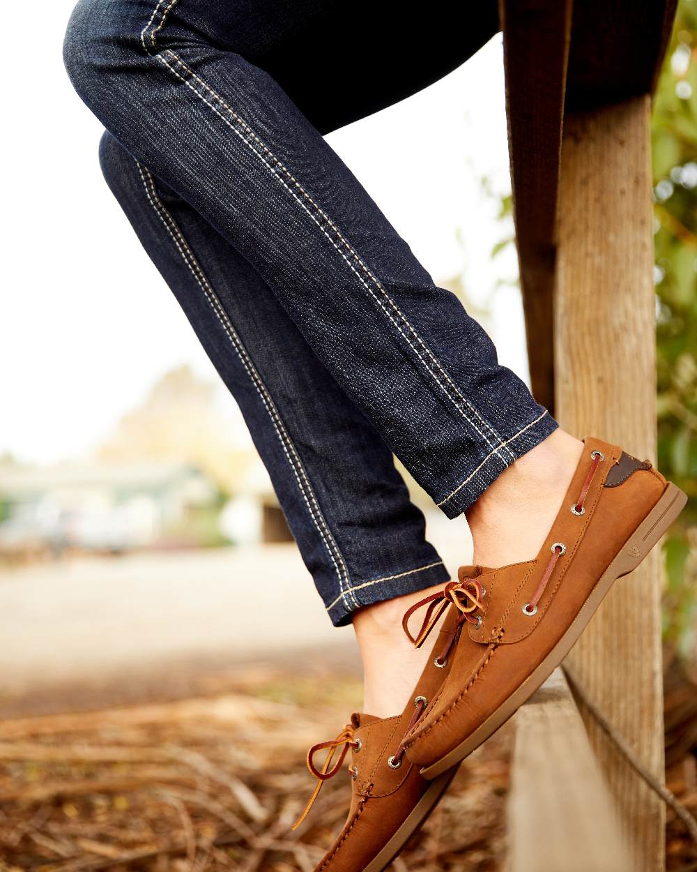 Celestial Coloured Ariat Womens Real Mid Rise Outseam Ella Skinny Jean on wooden fence background