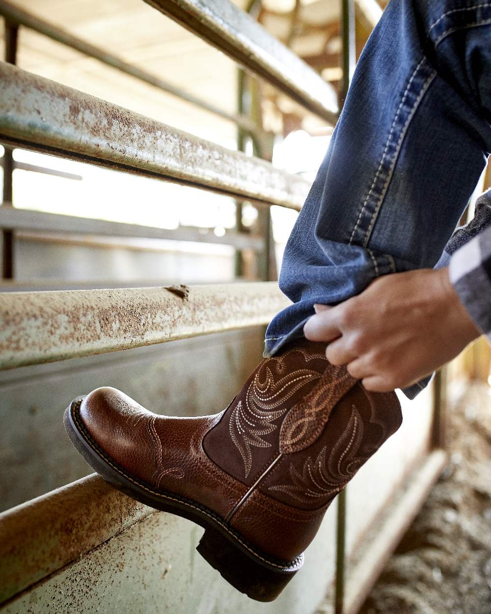 Rainstorm Coloured Ariat Womens Real Mid Rise Stretch Whipstitch Boot Cut Jeans on steel rod background