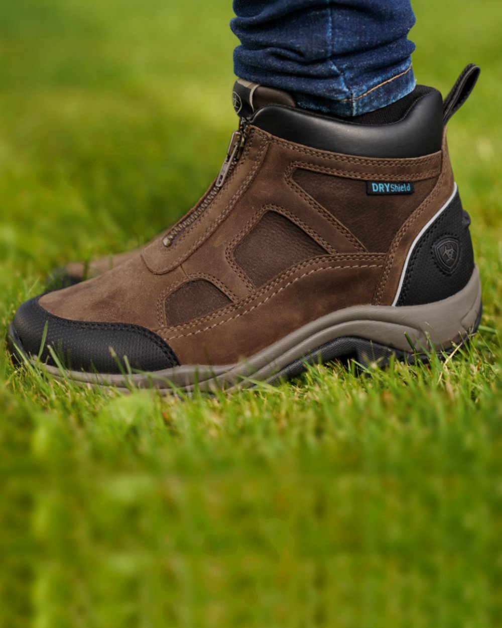 Palm Brown coloured Ariat Womens Terrain Zip Waterproof Boot on grass background