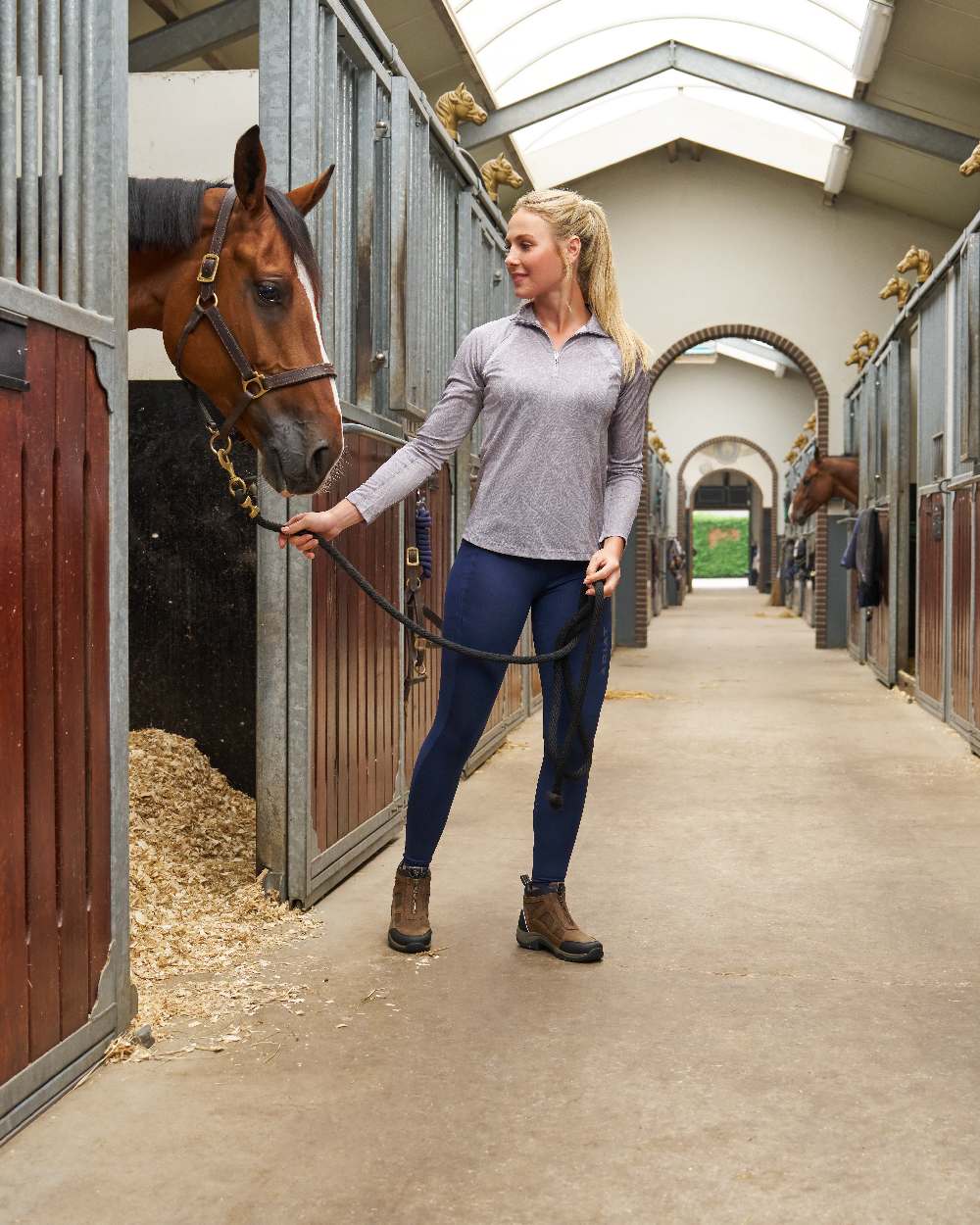 Palm Brown coloured Ariat Womens Terrain Zip Waterproof Boot on stable background