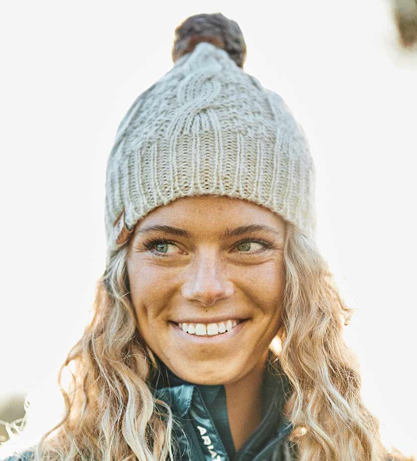 Ariat hats | woman wears Ariat knitted wool bobble hat.