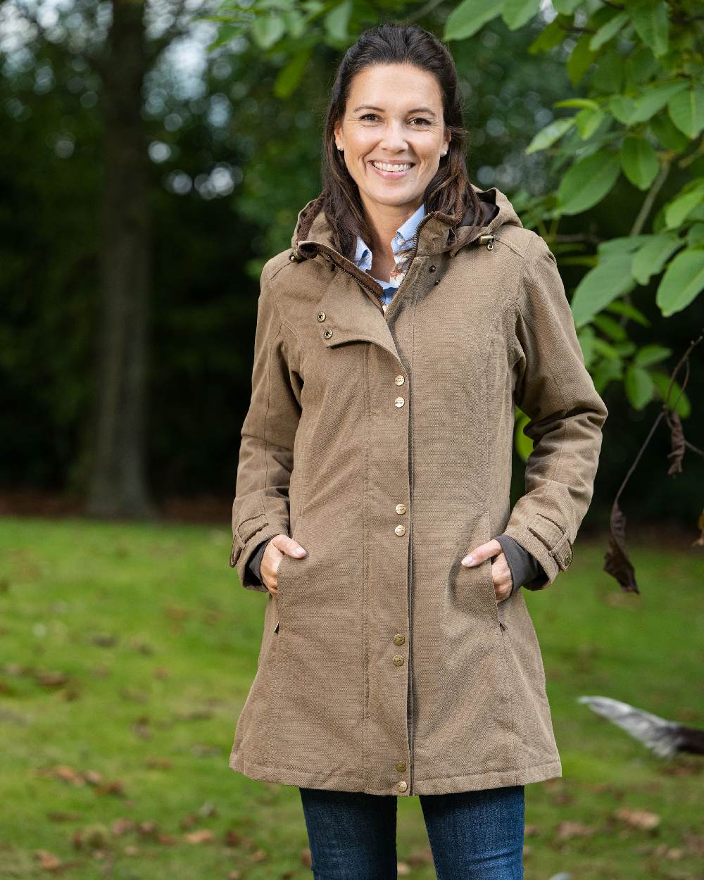 Camel Coloured Baleno Brooklands Waterproof Coat on forest background