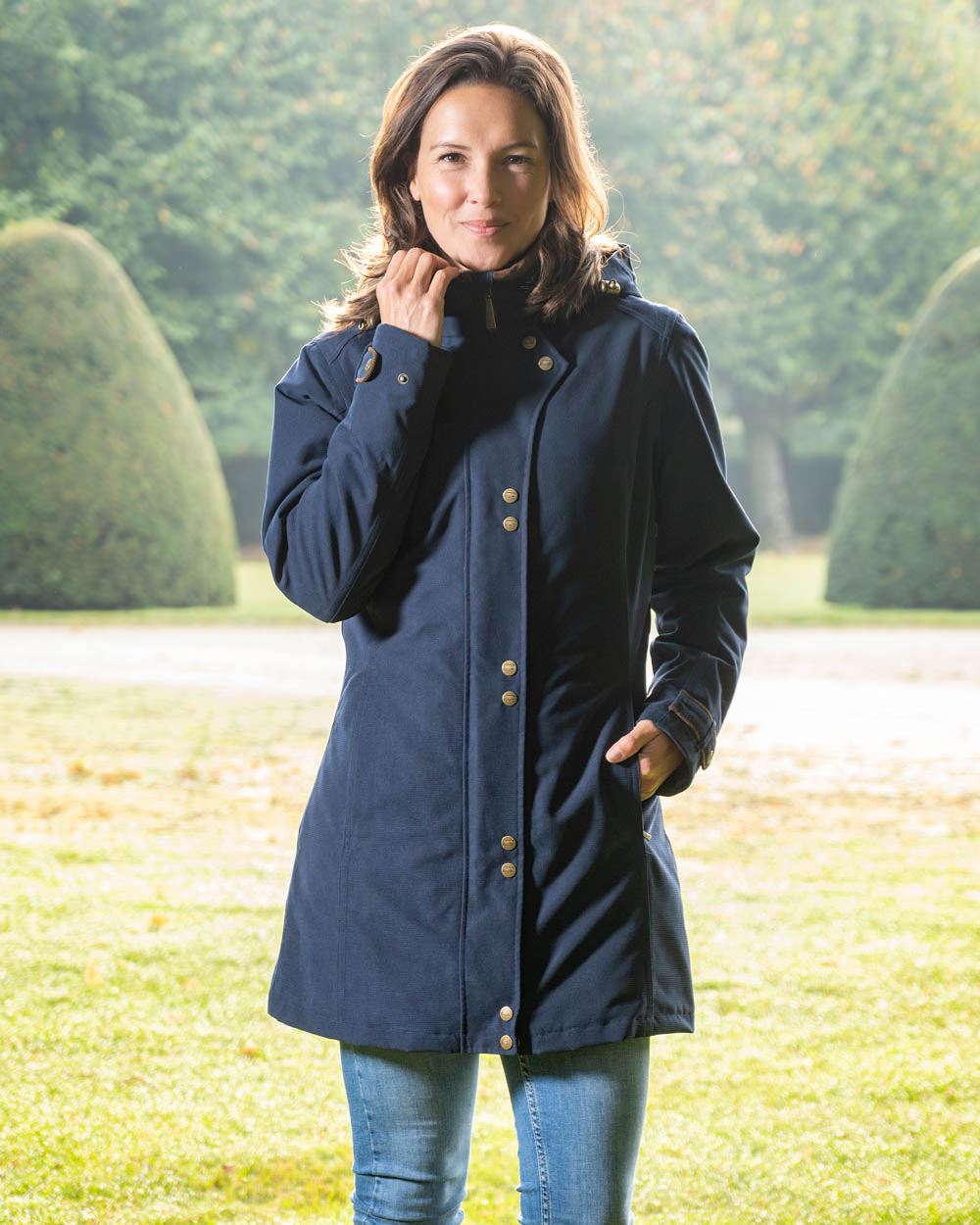 Dark Blue Coloured Baleno Brooklands Waterproof Coat on land background