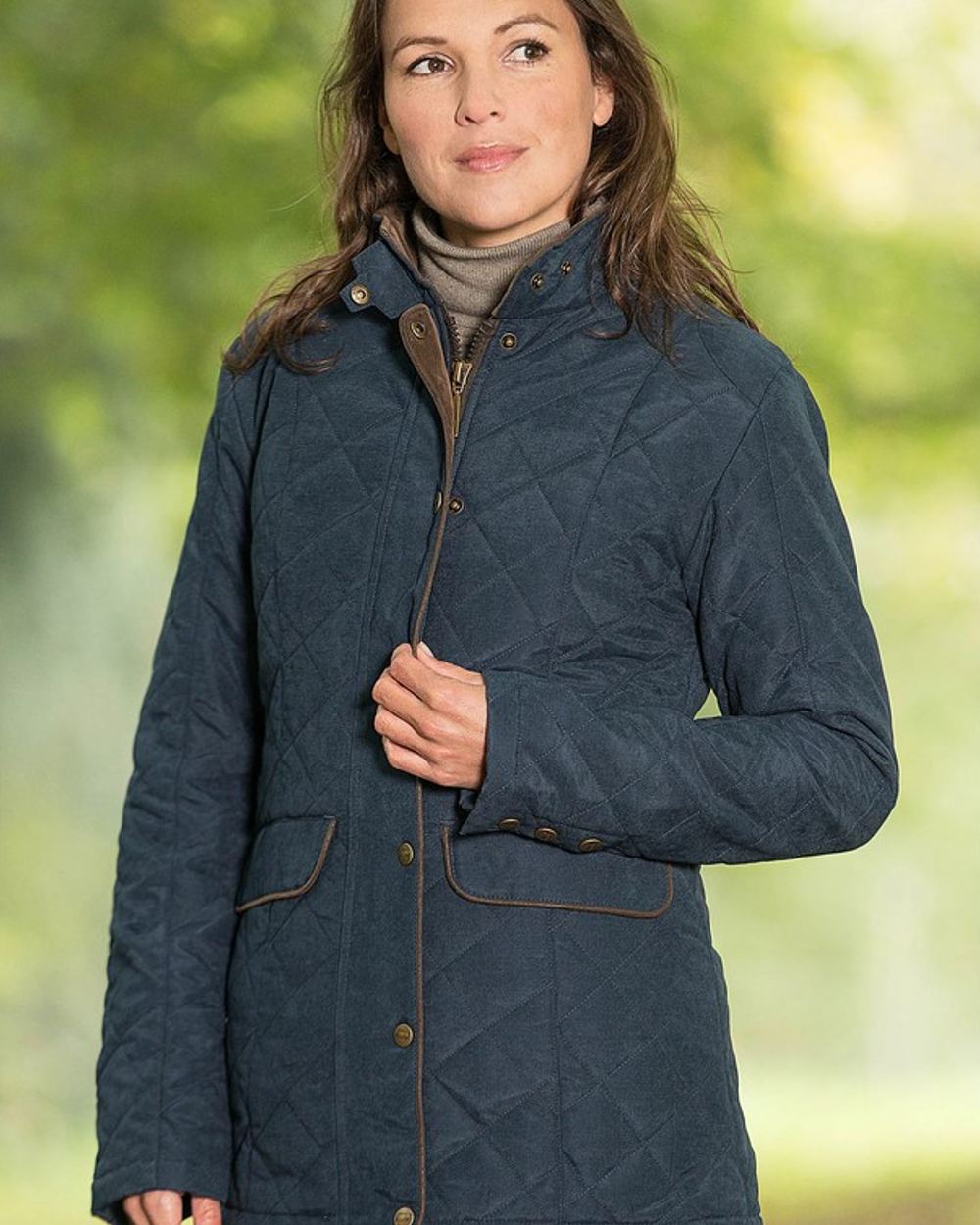 Navy Blue Coloured Baleno Cheltenham Quilted Jacket on blurry background