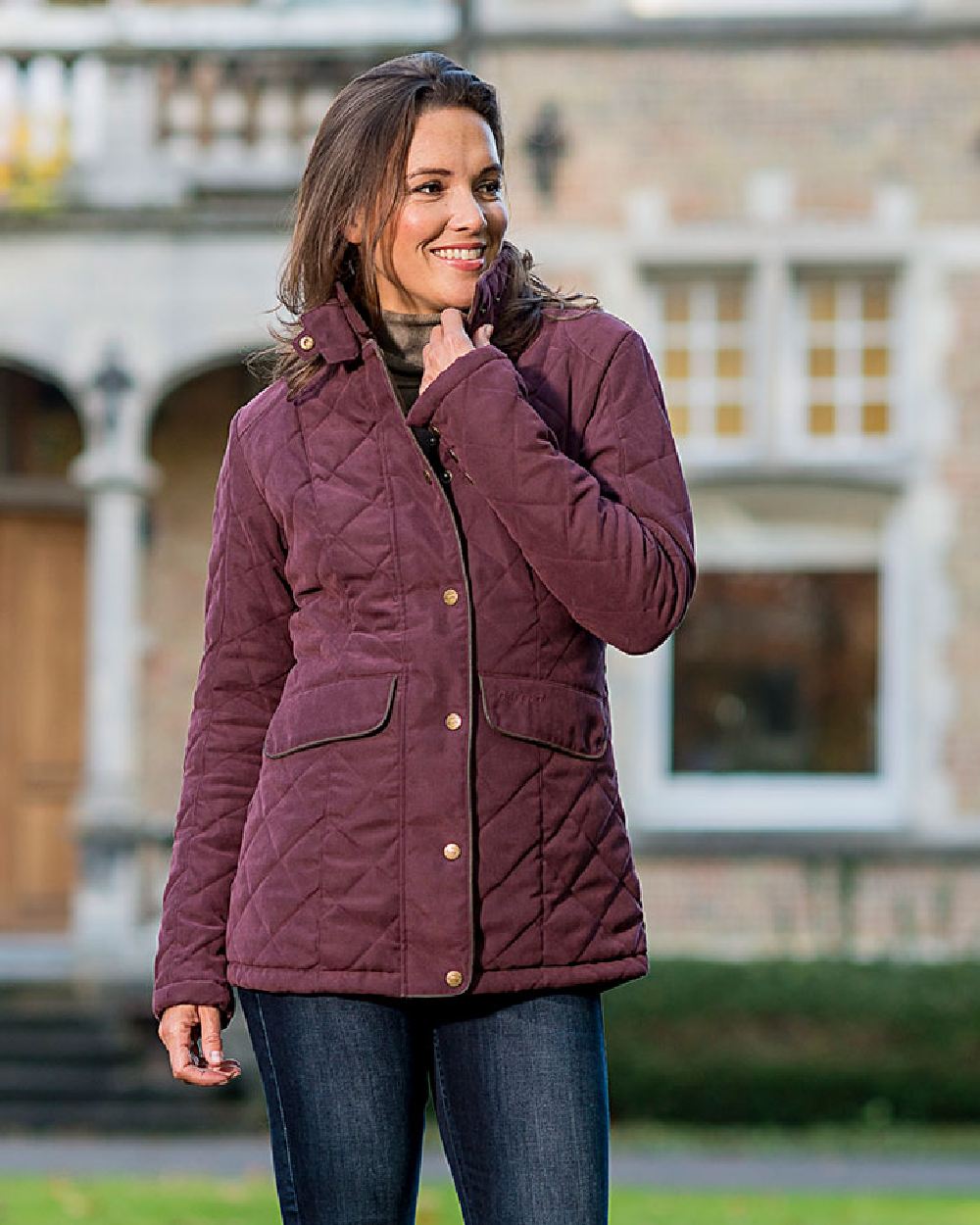 Plum Coloured Baleno Cheltenham Quilted Jacket on blurry background