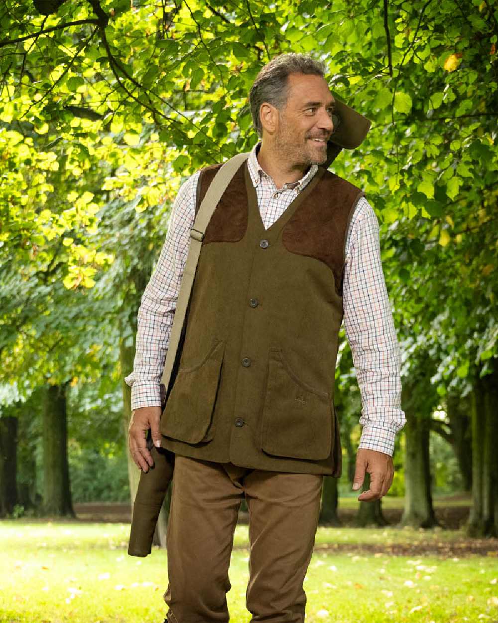 Pine Green Coloured Baleno Dolman Gilet on garden background
