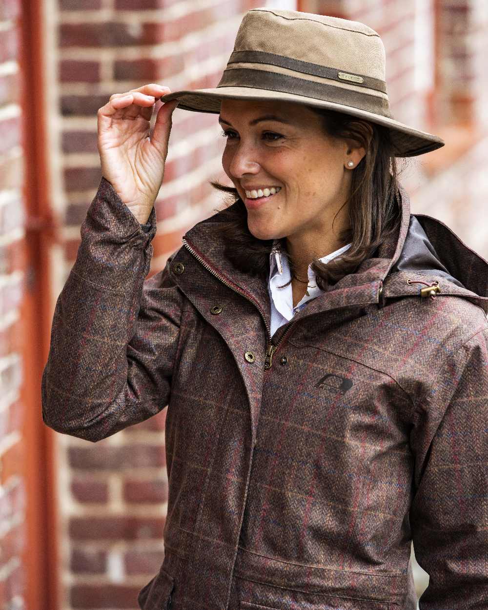 Camel Coloured Baleno Edith Waterproof Hat on blurry background