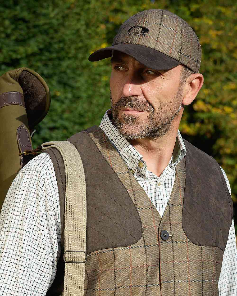 Check Khaki Coloured Baleno Edward Printed Tweed Cap on forest background