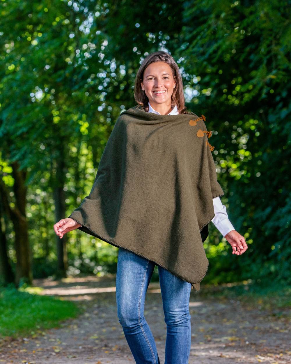 Moss Green Coloured Baleno Elite Fleece Poncho on forest background