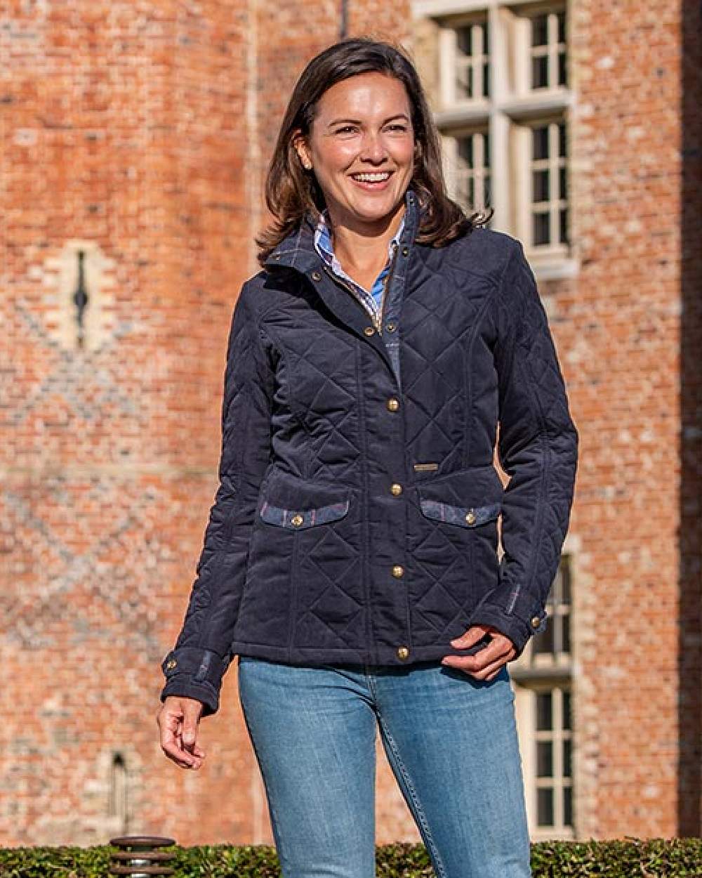 Dark Navy Blue Coloured Baleno Halifax Ladies Quilted Jacket on building background